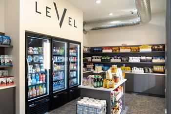 A store with a LEVEL sign on the wall and a variety of products on the shelves.at Level, Des Moines Iowa   
